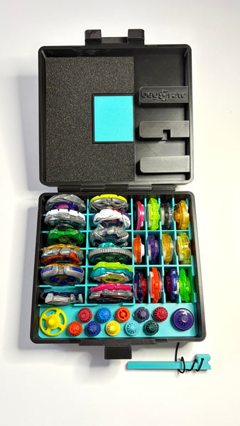 Beycrate 1 in Hyper Cyan, open and loaded with 12 Beyblade X blades, ratchets and bits